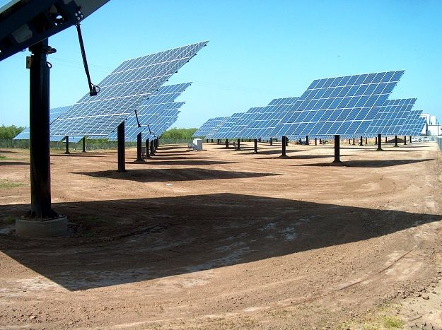 array of solar panels facing towards sun